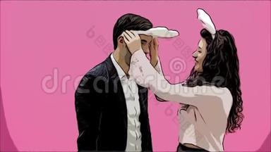 年轻情侣的粉色背景。 头上戴着黑黑的耳朵。 在这期间，女孩戴着兔子耳朵